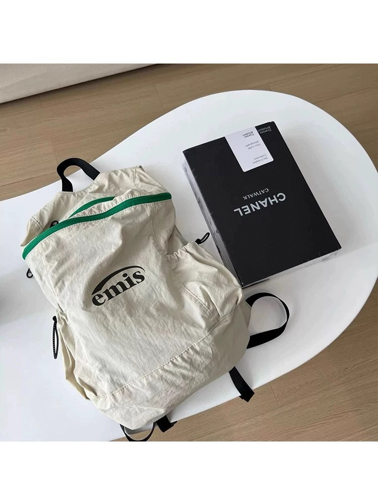 款号#1501 emis百搭双肩背包尼龙布旅行学生书包轻便大容量背包 颜色:黑色 米黄 尺寸:33×12×42cm · image 8