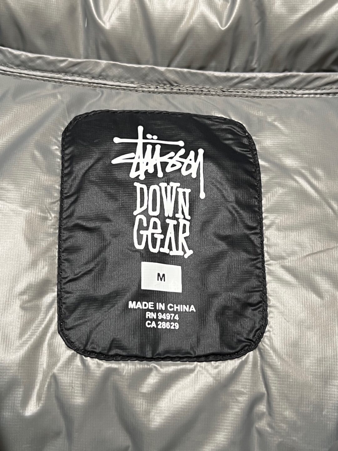 P879  Stussy down jacket · image 21